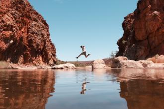  Jumping over rocks at Glen Helen